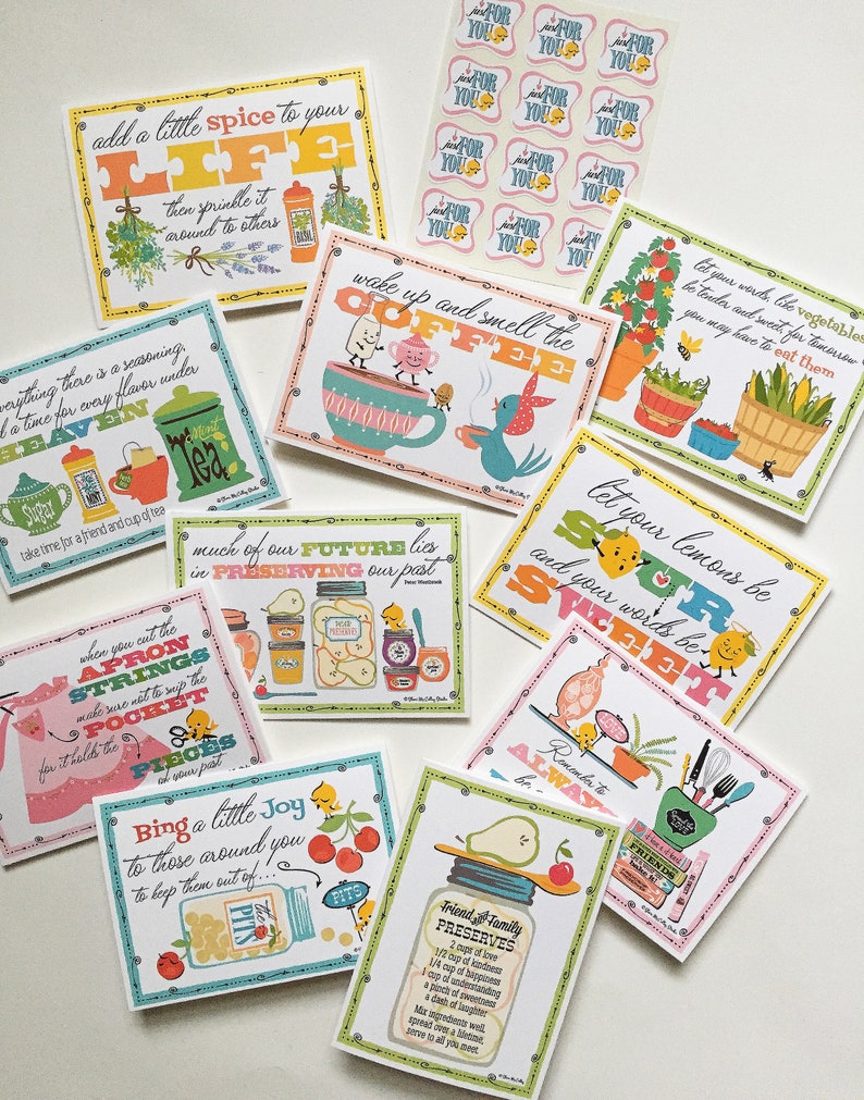 May include: A set of 10 colourful illustrated cards with inspirational quotes and sayings. The cards feature a variety of themes, including cooking, gardening, and friendship. The cards are perfect for adding a touch of whimsy and encouragement to any home.