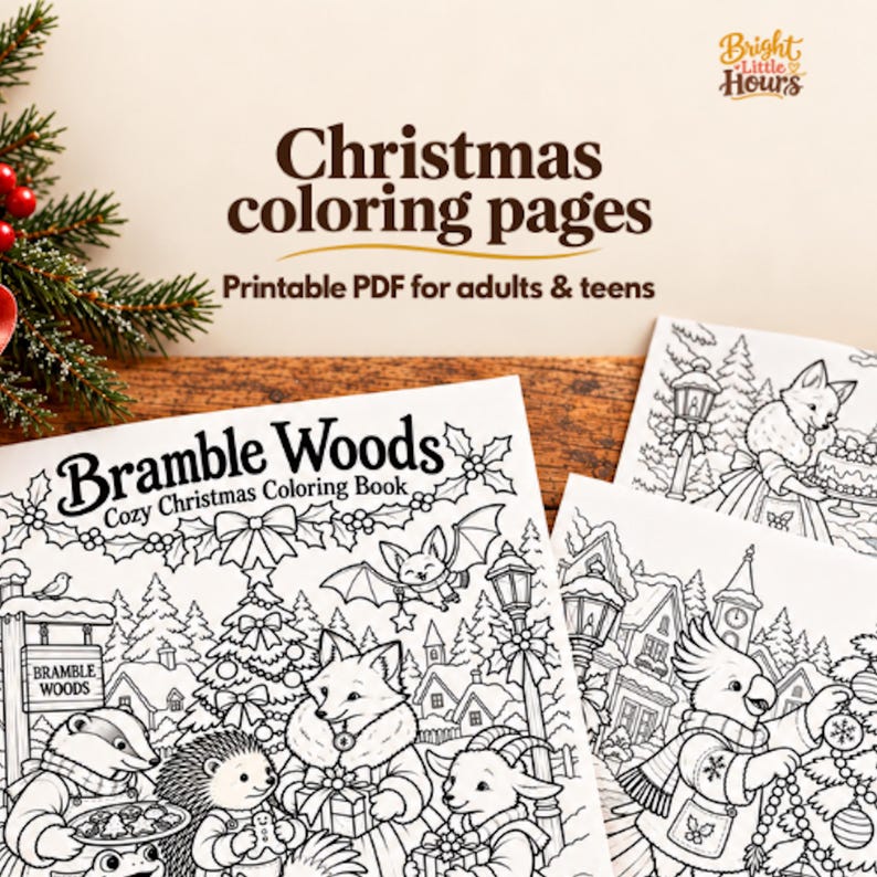 Bramble Woods Christmas coloring cover and overlapping cockatoo and fox coloring previews on a wooden table with pencils, evergreen sprigs and coral ribbon.