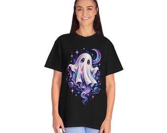 May include: A black short-sleeve t-shirt featuring a graphic print of a white ghost with a swirling galaxy pattern inside its body. The design includes a crescent moon, small planets with rings, and bright stars in shades of purple, blue, and pink.