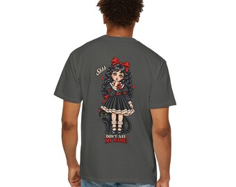 May include: A charcoal gray t-shirt featuring a graphic on the back of a girl with curly black hair and a red bow, wearing a black dress with white trim. She holds a finger to her lips with the text Shhh... and DON'T SAY MY NAME below.