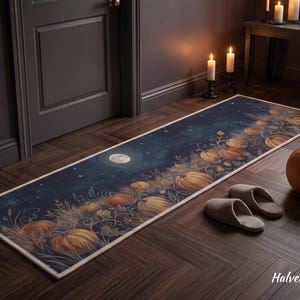 May include: A long rectangular runner rug featuring a dark navy blue night sky background with a full moon, scattered stars, and a field of orange pumpkins with vines and foliage. The rug has a light-colored border and the text HalveraRugs.
