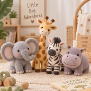 May include: A set of four felted animal plush toys including a gray elephant, a yellow and brown giraffe, a black and white zebra, and a purple hippo. Each animal features a soft, fuzzy texture, round black eyes, and small pink cheeks.