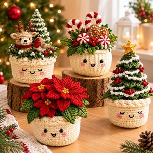 May include: Four crocheted cream-coloured pots with embroidered smiling faces, each containing different holiday-themed arrangements: a reindeer and tree, candy canes and gingerbread, a poinsettia, and a decorated Christmas tree with a star.