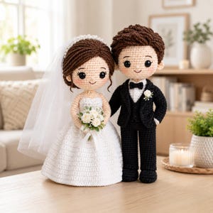 May include: Two crochet dolls representing a wedding couple. The figure on the left wears a white dress with a veil and holds a small bouquet of white flowers. The figure on the right wears a black suit with a white shirt, black bowtie, and a white boutonniere.