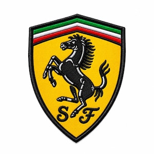 May include: A shield-shaped embroidered patch featuring a yellow background with a black prancing horse in the center. The top of the shield displays horizontal green, white, and red stripes. The letters S and F are embroidered in black at the bottom.