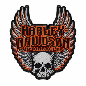 May include: A black, orange, and white embroidered patch featuring the text Harley-Davidson Motorcycles in bold orange lettering. The design includes a detailed white skull at the bottom and large, stylized wings extending upwards on both sides.