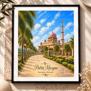May include: A framed wall art print depicting the Putra Mosque in Putrajaya, Malaysia, featuring a pink dome, a tall minaret, palm trees, and a paved walkway under a blue sky with clouds. The text reads Putra Mosque, Putrajaya, Malaysia.