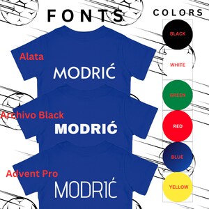 May include: Three blue t-shirts with the name "MODRIĆ" printed in white on each shirt. The shirts are stacked on top of each other. The text "FONTS" is at the top of the image, and the text "COLORS" is at the top right of the image. Below the shirts are color swatches for black, white, green, red, blue, and yellow.