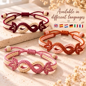May include: Three adjustable macrame bracelets featuring an infinity-style woven pattern with two decorative leaf-shaped accents. The bracelets are crafted in burgundy, burnt orange, and pink colourways, each paired with cream-coloured cord details.