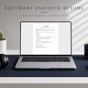 May include: A silver laptop displaying a software engineer resume template with the name Alex Kim at the top. The screen shows text sections for experience and skills. The laptop is placed on a dark blue desk mat with headphones and a mug.