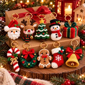 May include: A collection of ten crocheted Christmas keychains featuring a Santa Claus, reindeer, Christmas tree, snowman, gift box, candy cane, wreath, gingerbread person, stocking, and a bell, each attached to a gold-toned metal keyring.