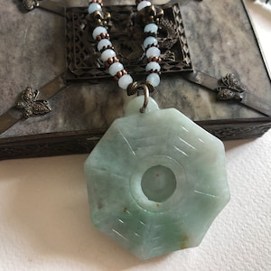 Outstanding necklace with a superb Jade pendant representing the Yin and Yang