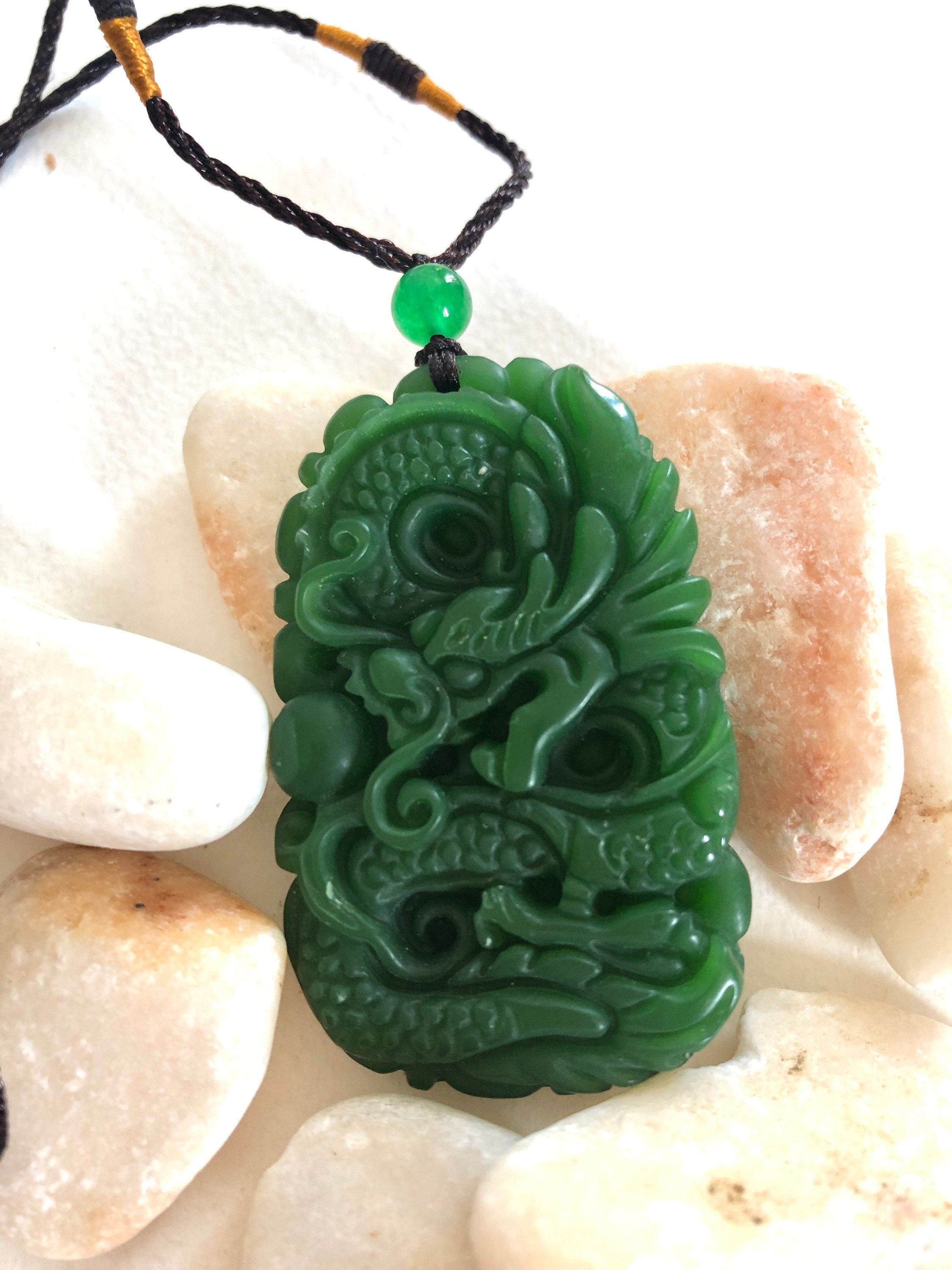 Vintage Chinese  green jade pendant on cotton string.