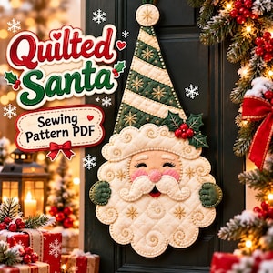 May include: A quilted Santa wall hanging featuring a green and white striped hat, a cream-colored face with a curly beard, and holly accents. The text reads Quilted Santa Sewing Pattern PDF. The design includes gold snowflake embroidery.