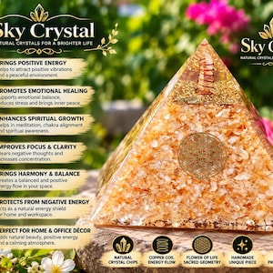 May include: A clear resin pyramid filled with amber-coloured crystal chips, featuring a copper coil at the apex and a gold Flower of Life symbol on the front. The text Sky Crystal appears at the top, with a list of benefits and features below.