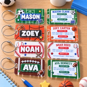 May include: Eight rectangular acrylic bag tags with metal cable loops, featuring sports themes like soccer, basketball, baseball, and football. Each tag displays a name, contact information, and medical details in white, blue, red, and green.