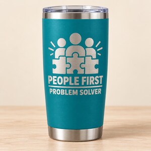 May include: A teal stainless steel tumbler with a clear lid and a silver base. The front features an engraved graphic of three stylized figures connected by puzzle pieces, with the text "PEOPLE FIRST" and "PROBLEM SOLVER" printed below.