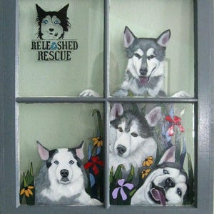 May include: A window with four panes, each featuring a painted image of a husky dog. The top left pane has the text "RELEASHED RESCUE".