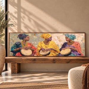 May include: A rectangular wall art print featuring three individuals wearing vibrant headwraps and colorful clothing, each playing a djembe drum. The artwork uses a textured, mosaic-like style with warm tones of yellow, red, and blue.