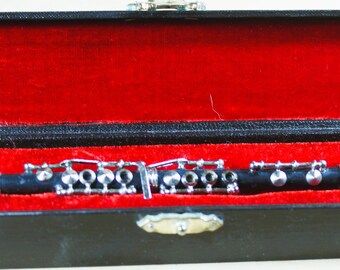 Clarinete miniatura detallado en caja