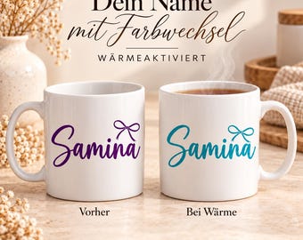 May include: Two white ceramic mugs featuring the name Samina in script font with a small bow icon. The left mug shows purple text labeled Vorher, while the right mug shows teal text labeled Bei Wärme, indicating a heat-activated color change.