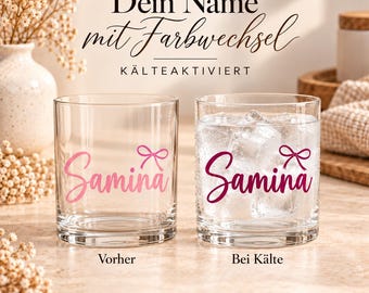 May include: Two clear glass tumblers featuring the name Samina in cursive script with a small bow icon. The left glass shows light pink text, while the right glass contains ice and shows dark magenta text. Text reads: Dein Name mit Farbwechsel KÄLTEAKTIVIERT.