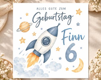 May include: A square birthday card featuring a watercolor illustration of a rocket ship, a planet with rings, a crescent moon, and yellow stars. The text reads ALLES GUTE ZUM GEBURTSTAG Finn 6 in blue script and block lettering.