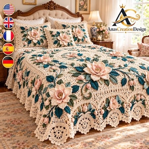May include: A cream-colored crochet bedspread and matching pillow shams featuring three-dimensional pink floral appliques and dark teal green leaves. The textile displays an intricate openwork lace pattern with a scalloped edge and floral motifs.
