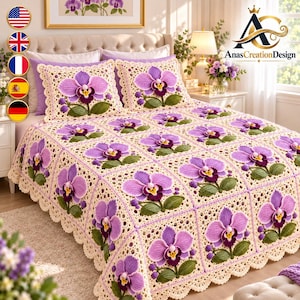 May include: A cream-colored crochet bedspread and two matching pillow shams featuring a repeating square pattern. Each square displays a three-dimensional purple orchid flower with green leaves and a dark center, finished with a scalloped edge.