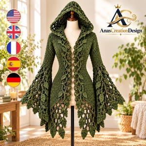 May include: An olive green crochet hooded cardigan featuring a front button closure and long, flared sleeves adorned with intricate leaf-shaped motifs. The garment displays a textured stitch pattern throughout and includes the text AnasCreationDesign.