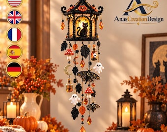 May include: A hanging decorative mobile featuring a black lantern structure with a silhouette of a cat inside. It includes dangling charms of white ghosts, red and white mushrooms, moths, crescent moons, small glass bottles, and orange crystals.