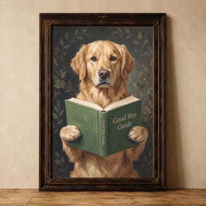 May include: A framed wall art print featuring a golden retriever holding an open green book titled Good Boy Guide. The dog has light golden fur and is centered against a dark background with subtle leaf patterns. The frame is dark brown wood.