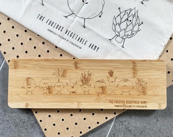 SECONDS Furious Vegetable Army Long Chopping Board - handdrawn illustrations laser etched onto bamboo board.