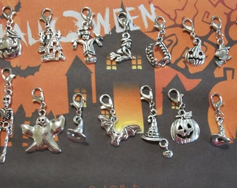 May include: A collection of 14 silver Halloween-themed charms. The charms include a ghost, a skeleton, a witch, a bat, a pumpkin, a haunted house, a witch's hat, a broom, a vampire's teeth, and a spider web. The charms are all attached to silver lobster clasps.
