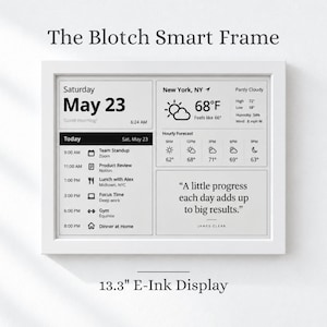 May include: The Blotch Smart Frame is a 13.3-inch E-Ink display featuring a white frame. The screen shows a digital dashboard with the date May 23, a weather forecast for New York, a daily schedule of tasks, and a quote by James Clear in black text.