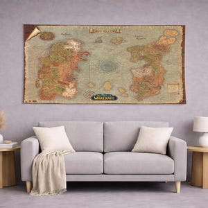 May include: A rectangular wall tapestry featuring a detailed, vintage-style map of the World of Warcraft game world. The map displays two large continents separated by a central ocean with a whirlpool, labeled with the World of Warcraft logo.