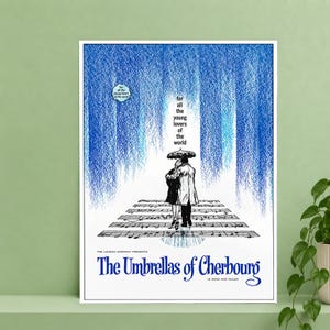 May include: A film poster for The Umbrellas of Cherbourg showing a couple under an umbrella standing on musical staff lines. The background features blue vertical streaks. Text reads: for all the young lovers of the world, The Landau Company Presents.