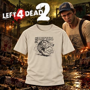 May include: A beige short-sleeve t-shirt featuring a black graphic print of a stylized creature with sharp teeth and the text Bull Shifters. The design is centered on the chest of the garment, which is displayed against a dark, gritty background.