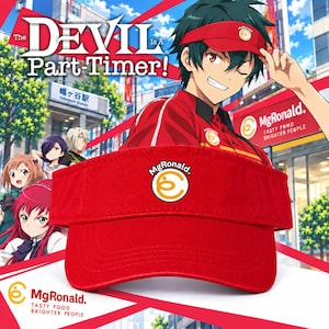 May include: A bright red visor featuring the MgRonald logo, which consists of a stylized yellow letter C inside a circle, embroidered on the front center. The visor has a structured brim with visible stitching and an adjustable strap at the back.