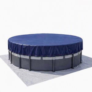 May include: A round, above-ground swimming pool featuring a dark grey frame and a solid navy blue pool cover secured over the top. The pool sits on a light grey ground tarp, and the structure is supported by vertical grey poles around the perimeter.