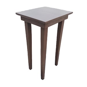 May include: A dark brown wooden end table with a square top and four legs. The table is made of solid wood and has a simple, rustic design.