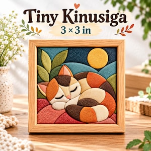 May include: A square framed wall art piece titled Tiny Kinusiga measuring 3 x 3 inches. The artwork features a multi-colored fabric mosaic of a sleeping calico cat with orange, brown, and cream patches, set against a dark blue background with a yellow sun.