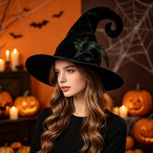 May include: A black velvet witch hat featuring a tall, curved pointed crown and a wide brim. The hat is adorned with a dark fabric rose and several dark green feathers attached to the side, creating a textured and layered appearance.