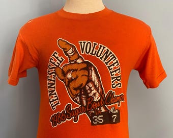 Camiseta vintage de los años 80 de la Universidad de Tennessee Volunteers (UT), campeón del Sugar Bowl de 1986 (talla pequeña)