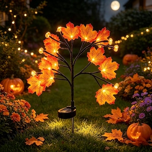 May include: A solar-powered garden stake light featuring a black stem and branches adorned with illuminated orange and red maple leaves. The light includes a small solar panel at the base and emits a warm glow, designed for outdoor lawn decoration.