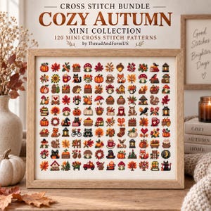 May include: A framed cross stitch sampler featuring 120 small autumn-themed icons, including pumpkins, leaves, animals, and seasonal items. The text at the top reads CROSS STITCH BUNDLE COZY AUTUMN MINI COLLECTION 120 MINI CROSS STITCH PATTERNS by ThreadAndFormUS.
