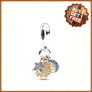 May include: A silver charm featuring a dangling sun, moon, and star design. The sun is gold-toned with clear stones, the star is silver with clear stones, and the crescent moon is silver with blue stones. A badge reads BUY 2 GET 1 FREE.