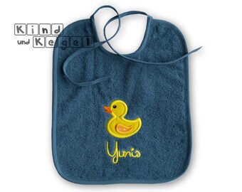 Terry bib duck yellow 25 x 30 cm on dark blue + name, for tying