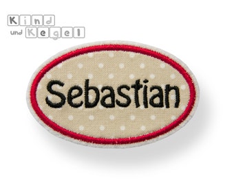 Patch patch oval shield + name black, 7.5 x 4.5 cm, fabric beige-white-dotted, contour red, frame, name plate, label