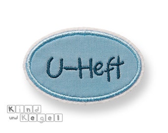 Aufnäher Aufbügler ovales Schild + U-Heft dunkelblau, 7,5 x 4,5 cm, Stoff hellblau uni, Kontur hellblau, Rahmen, Namensschild, Label